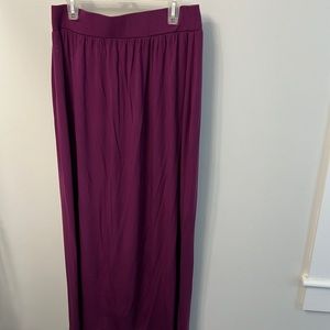 Stretchy, lightweight eggplant colored long skirt. Casual. Wide elastic waist.